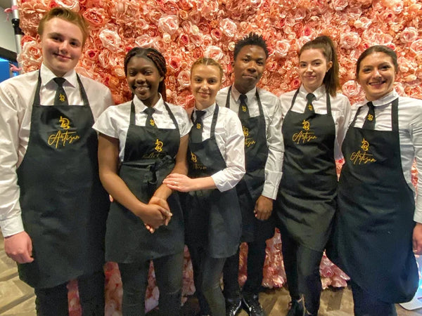 Little Dessert Shop team in embroidered black aprons, white shirts and bespoke ties