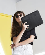 Essential 13 laptop case" — lifestyle