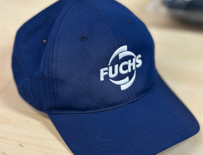 Navy baseball cap embroidered with the FUCHS logo in white thread, part of the Fuchs Lubricants UK branded workwear range