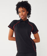 Women's piped performance polo — lifestyle