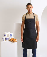 Cotton bib apron, organic and Fairtrade certified — lifestyle