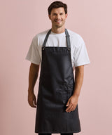 District waxed-look denim bib apron — lifestyle