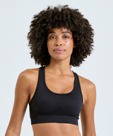 Tridri® seamless 3D fit" multi-sport sculpt solid colour bra" — lifestyle